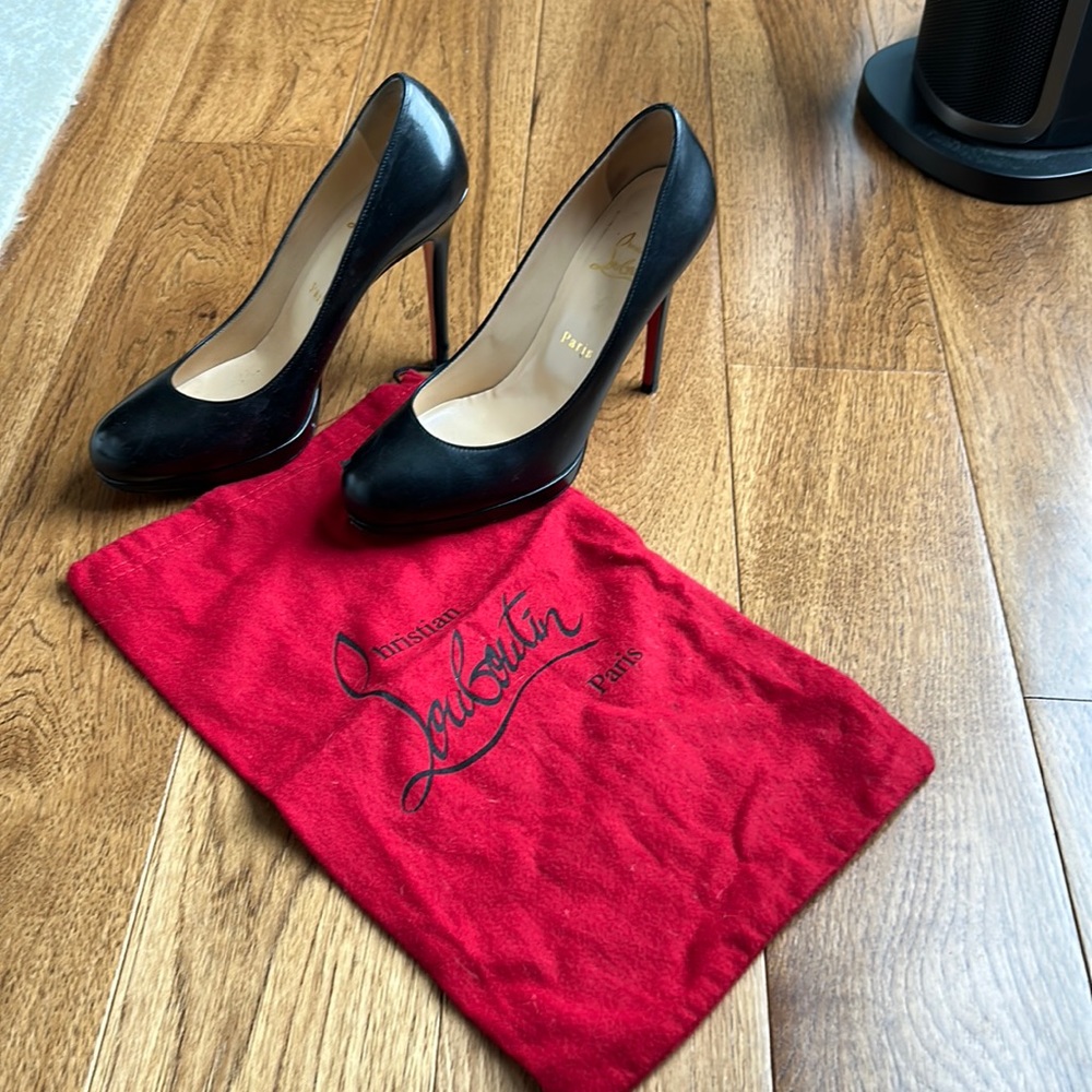 Christian Louboutin platform heels and dust bag.
